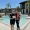 man and woman standing by a pool